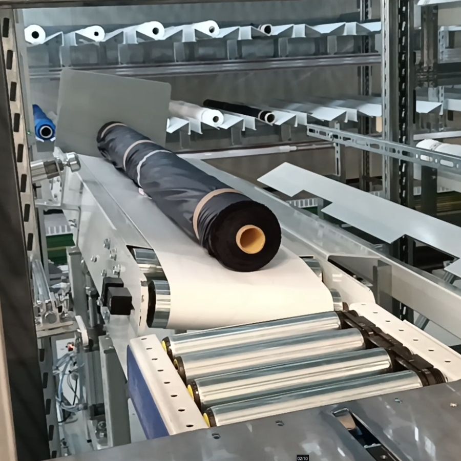 Conveyor and shuttle handling system for fabric rolls